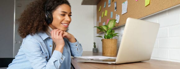 woman working from home learning the current trends in human services