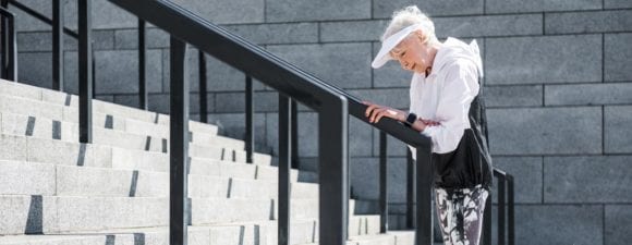 elderly woman climbing stairs