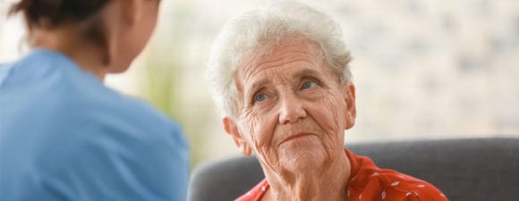 older woman with caretaker