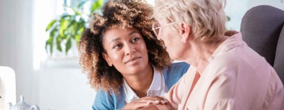 Caregiver focusing on older patient
