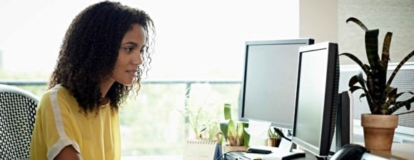 Woman working at desktop computer