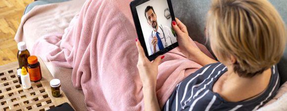 A patient using telehealth, an increasing trend in 2023.