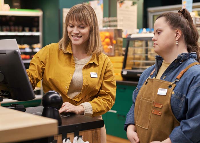 A properly trained manager proving on the job autism social skills training for an employee