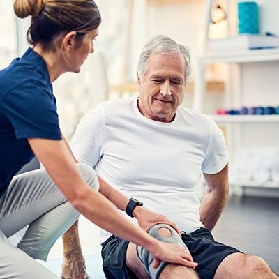 A physiotherapist working with a senior patient
