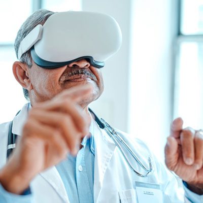 https://www.relias.com/wp-content/uploads/2023/03/clinician-using-VR-headset.jpg