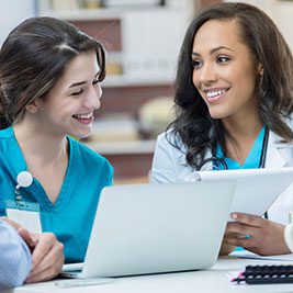 Nurses review a competency evaluation tool