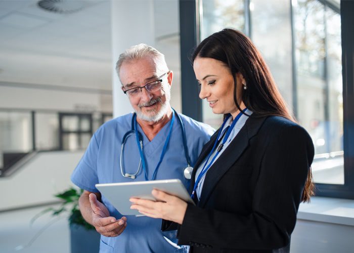 Two healthcare professionals engaging in integrated care management