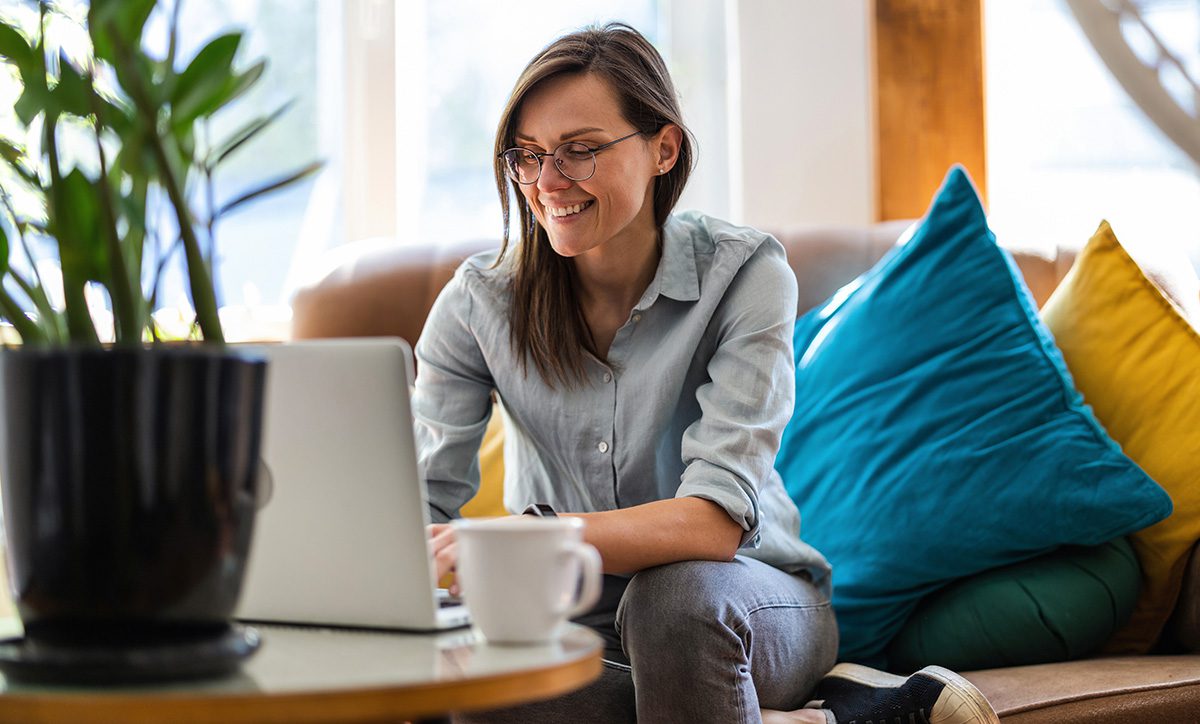 woman smiles in her living room
