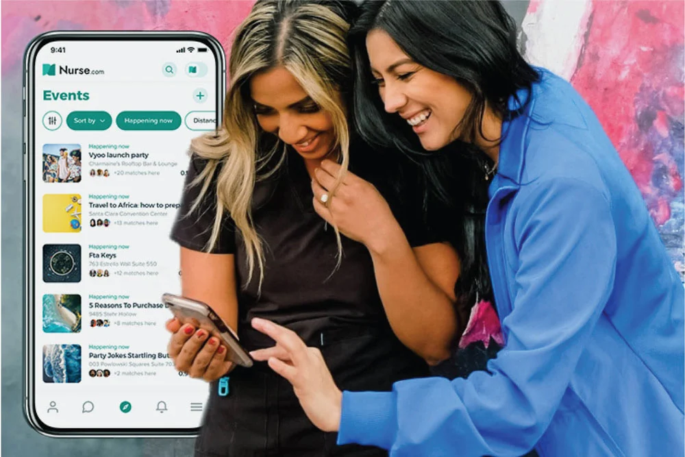 two women smile at phone together