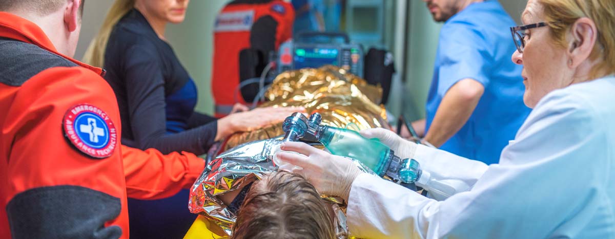 Hospital team helping man with hypothermia