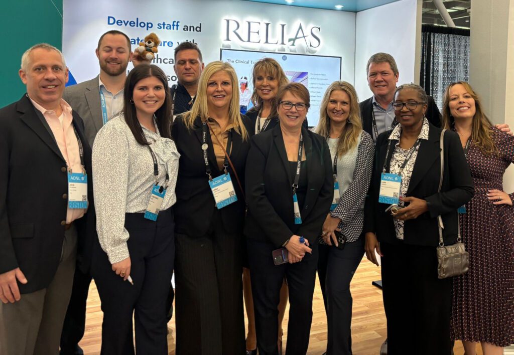Relias staff members at their booth for a national conference.
