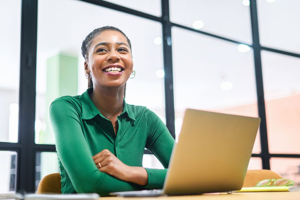 A healthcare professional smiles when completing her healthcare learning,